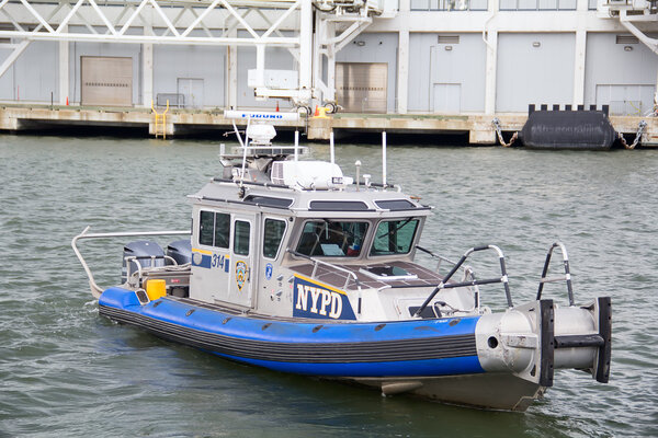 Police boat leaving pier  in NYC