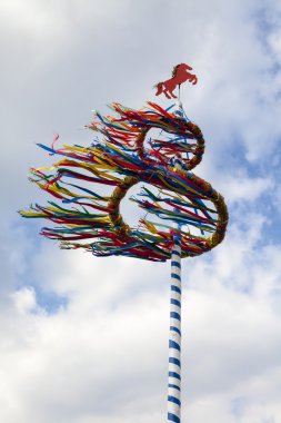 Maypole in the wind, Osnabrueck country, Germany clipart