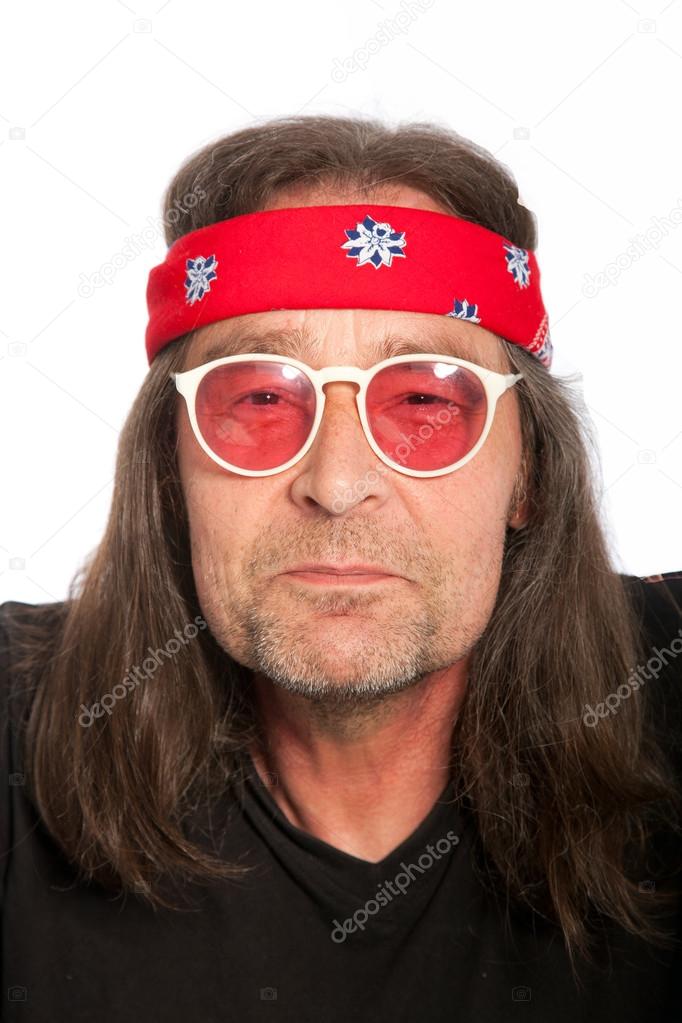 Mature Hippie Wearing Headband and Glasses