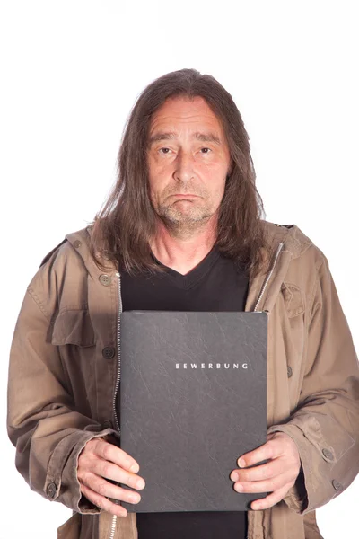 Sad Man with Long Hair Holding Folder — Stock Photo, Image