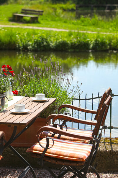 Vintage Wooden Table and Chair on Water Side