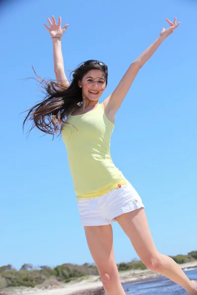 Pretty Woman in Jump Shot at the Beach — Stock Photo, Image