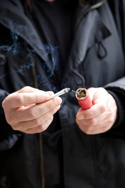 Man lit firework in a dangerous way — Stock Photo, Image