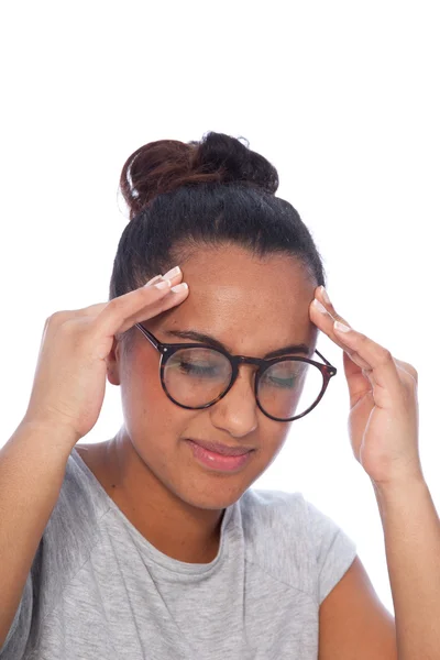 Junge Frau mit Kopfschmerzen hält ihren Kopf Stockbild