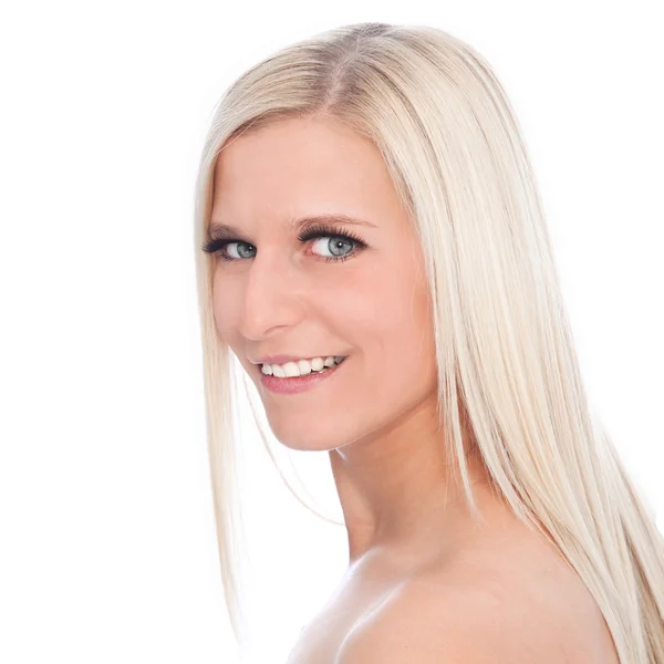 Portrait of Smiling Blond Woman with Bare Shoulders in Studio with White Background Royalty Free Stock Images