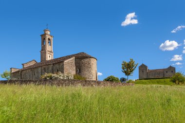 Old church under blue sky in Piedmont, Italy.