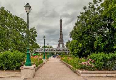 Urban park and Eiffel Tower in Paris, France.