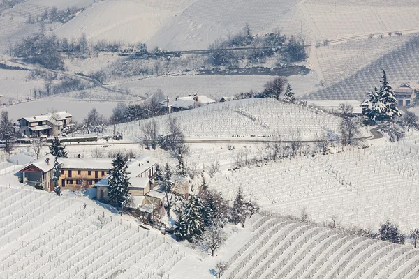 Rural houses on snowy hills. — Stock Photo, Image