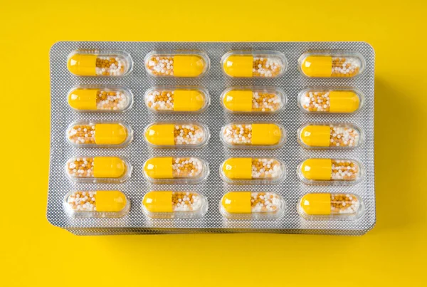 Yellow Pills Blister Yellow Cardbox Bacckground — Stock Photo, Image