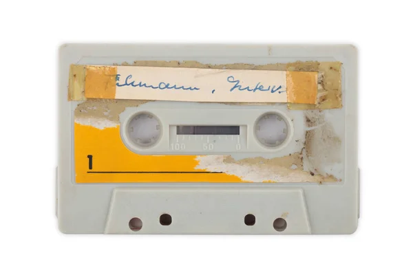 白の上に隔離されたラベル付きの中古オーディオテープ背景 — ストック写真
