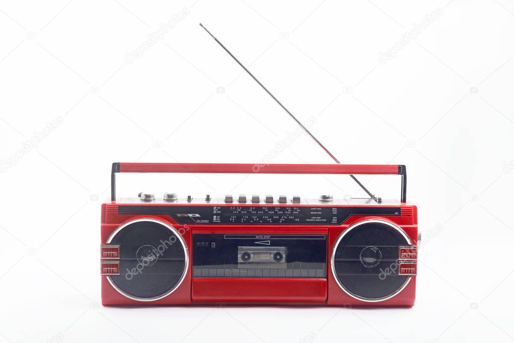 Red vintage Cassette player with open antenna isolated on white background
