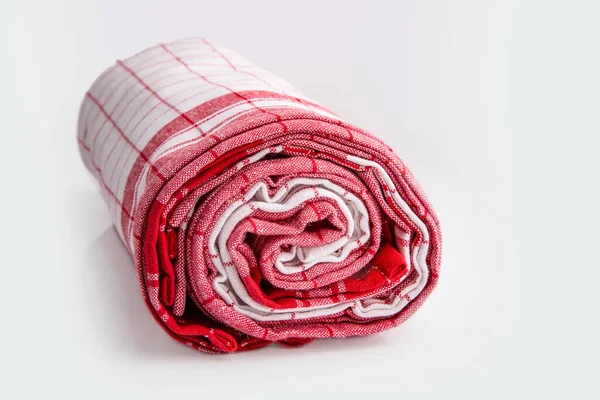 Rolled Nádobí Oblečení Přes Světlé Pozadí — Stock fotografie