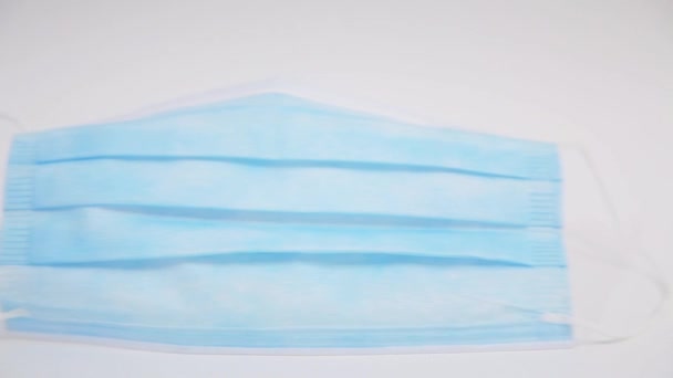 錠剤のブリスター上に停止して青保護マスクの高速水平パンニング — ストック動画