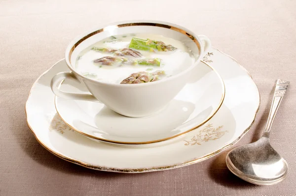 Green creamy asparagus soup in a bowl — Stock Photo, Image