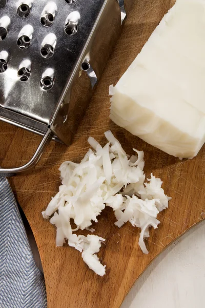 Grated lard on a wooden board — Stock Photo, Image