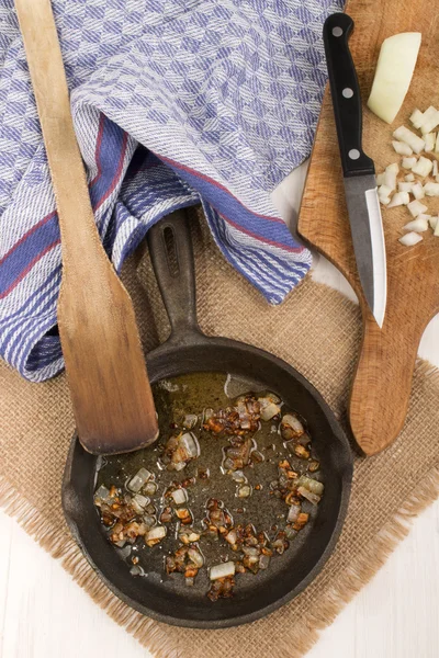 Roasted onion in a cast iron pan — Stock Photo, Image