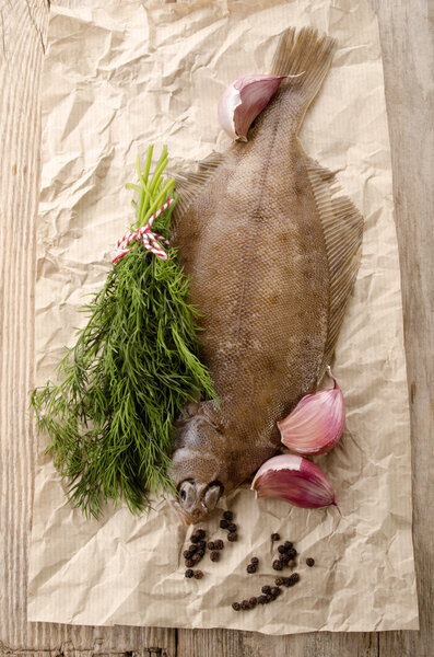 fresh plaice on kitchen paper