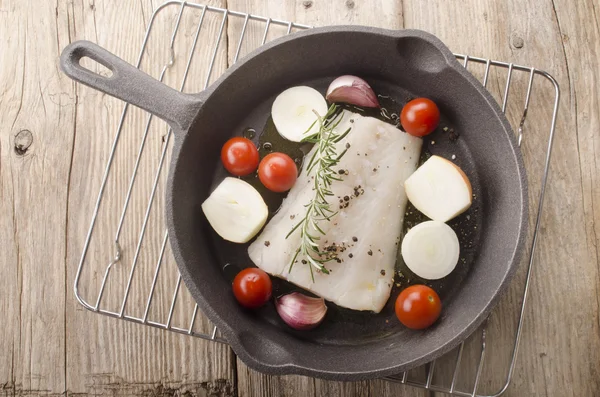 Cod fillet in a cast iron pan — Stock Photo, Image