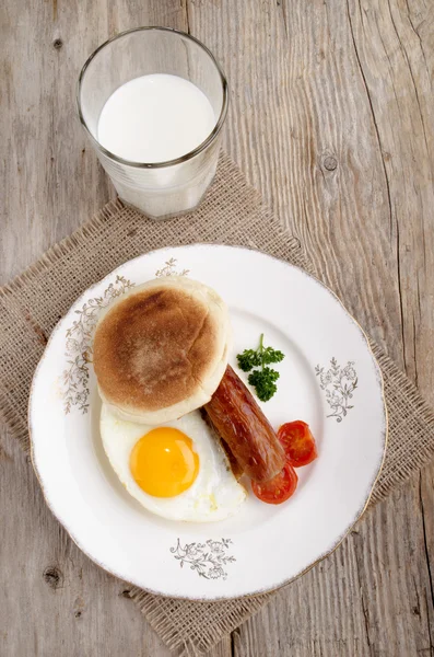 Sausage and fried egg on a plate — Stock Photo, Image
