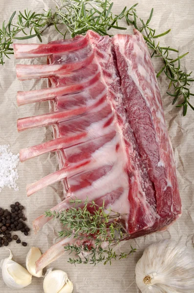 Rack of lamb on brown paper — Stock Photo, Image