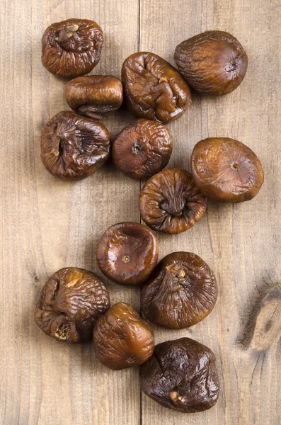 Some dried figs on wood — Stock Photo, Image