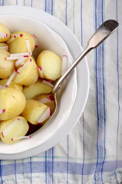 Organic baby potatoes chopped radish — Stock Photo, Image