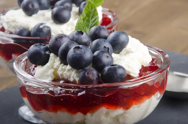 Trifle with cream and blueberries — Stock Photo, Image