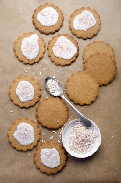 Cookie with icing and sprinkles — Stock Photo, Image