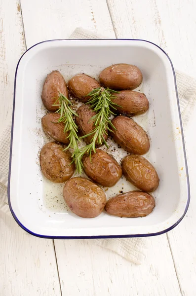 Baked half potato with rosemary — Stock Photo, Image