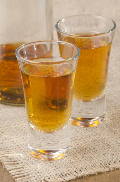 Alcoholic drink in a shot glass — Stock Photo, Image