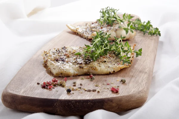 Smoked cod with thyme and spices — Stock Photo, Image