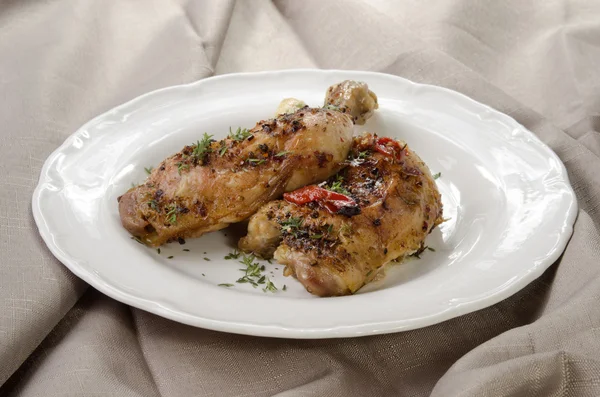 Thyme chicken drumsticks on a plate — Stock Photo, Image