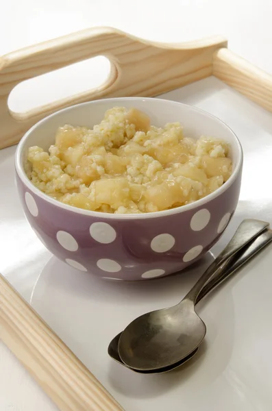 Breakfast with millet gruel and apple sauce — Stock Photo, Image