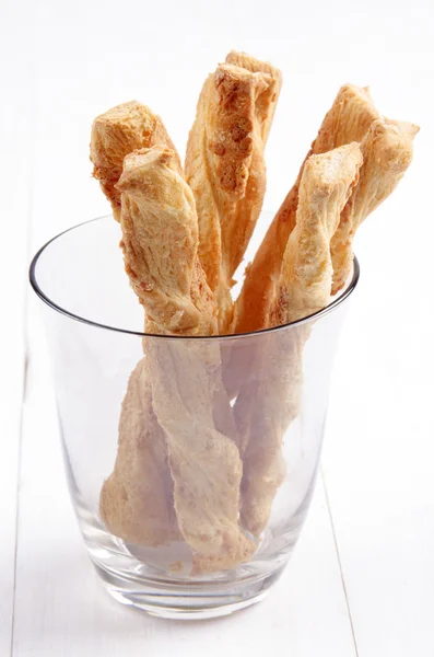 Butter cheese sticks in a glass — Stock Photo, Image