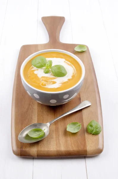 Sweet potato soup with cream and basil — Stock Photo, Image