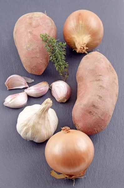 Ingredients to make a sweet potato onion soup — Stock Photo, Image