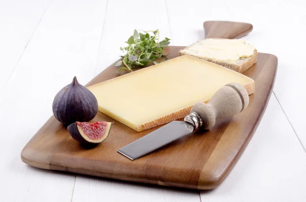 Swiss hard cheese on wooden board — Stock Photo, Image