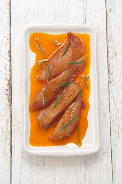 Marinated chicken fillet stripes on a plate — Stock Photo, Image