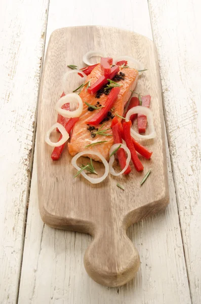 Grilled salmon fillet on wooden board — Stockfoto