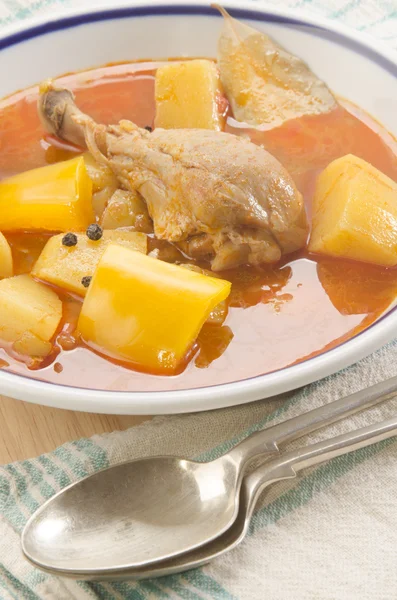 Potato soup with chicken drumstick Stock Image