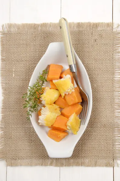 Cooked sweet potato with smoked cod and thyme — Stock Photo, Image