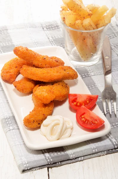 Breaded chicken nuggets with mayonnaise and tomato — Stock Photo, Image