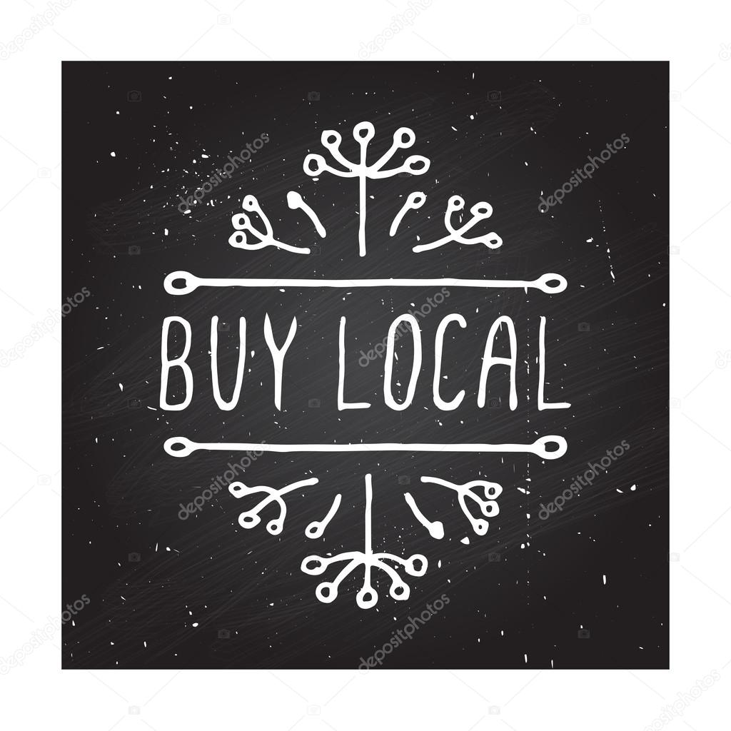 Hand-sketched typographic elements on chalkboard background. Buy local