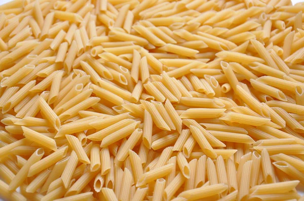 Close up of yellow raw italian pasta — Stock Photo, Image