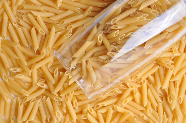 Close up of yellow raw italian pasta — Stock Photo, Image