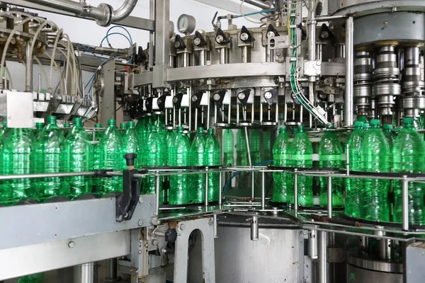 Automatic conveyor line with plastic bottles at the mineral water production plan