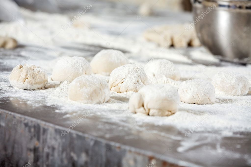 Dough Balls Covered With Flour On Table