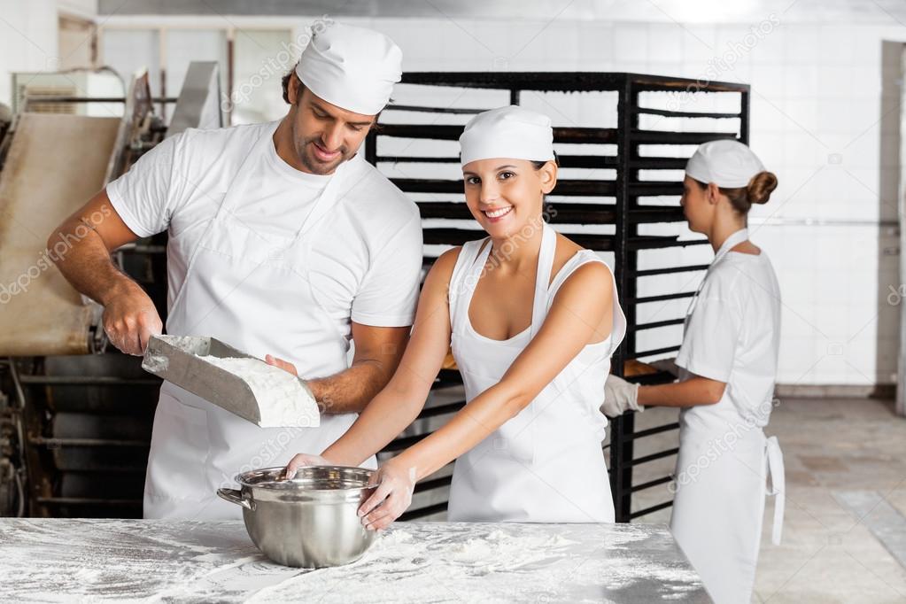 Bakers Working Together In Bakery
