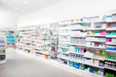 Products Arranged In Shelves At Pharmacy clipart