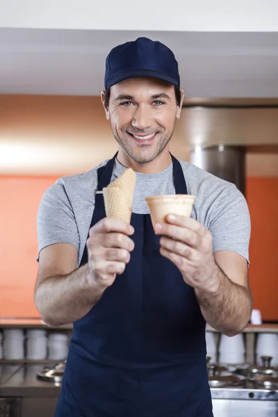 Confident Waiter showing Cup And Cone — Stock Photo, Image